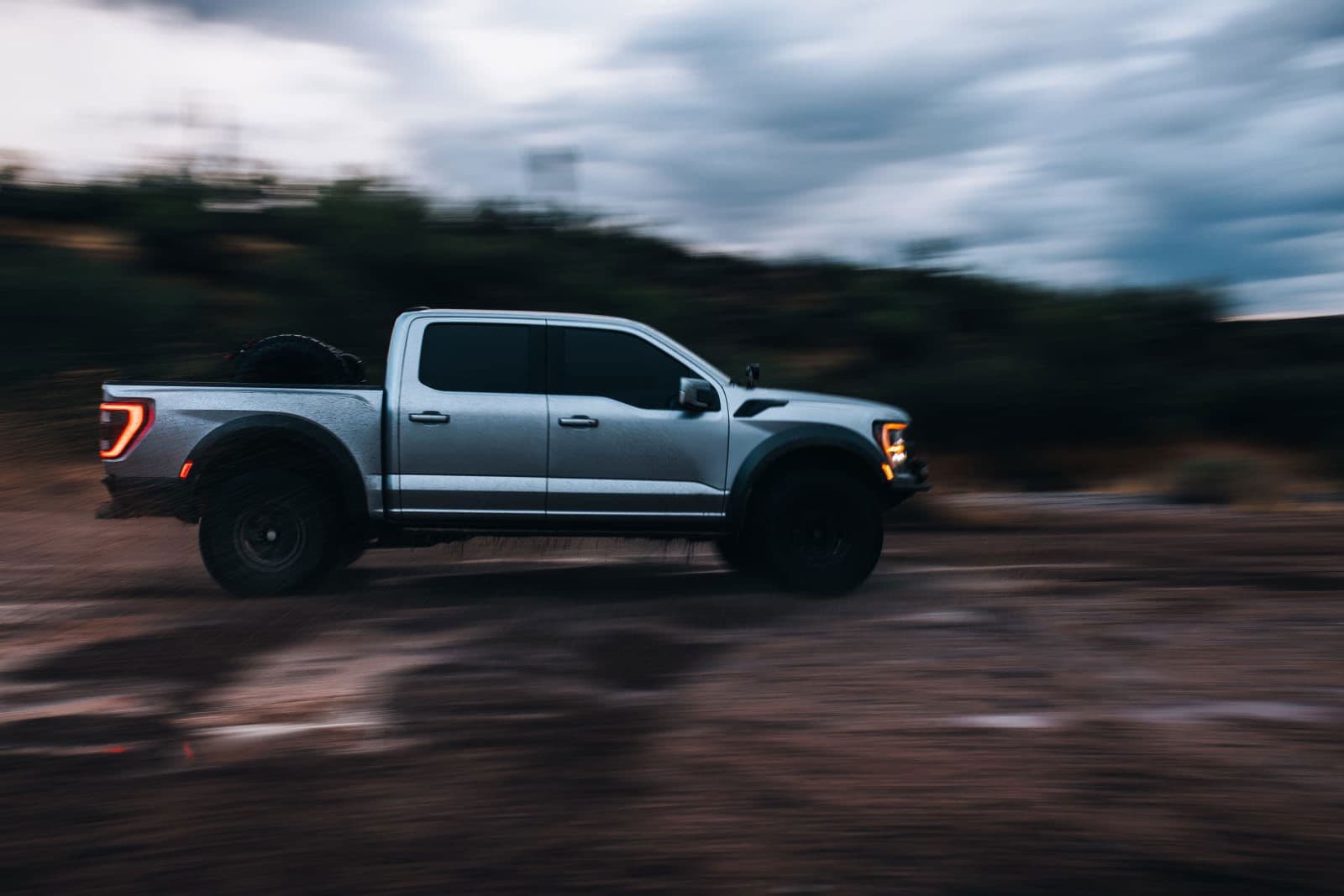 Ford Raptor panning shot at dusk