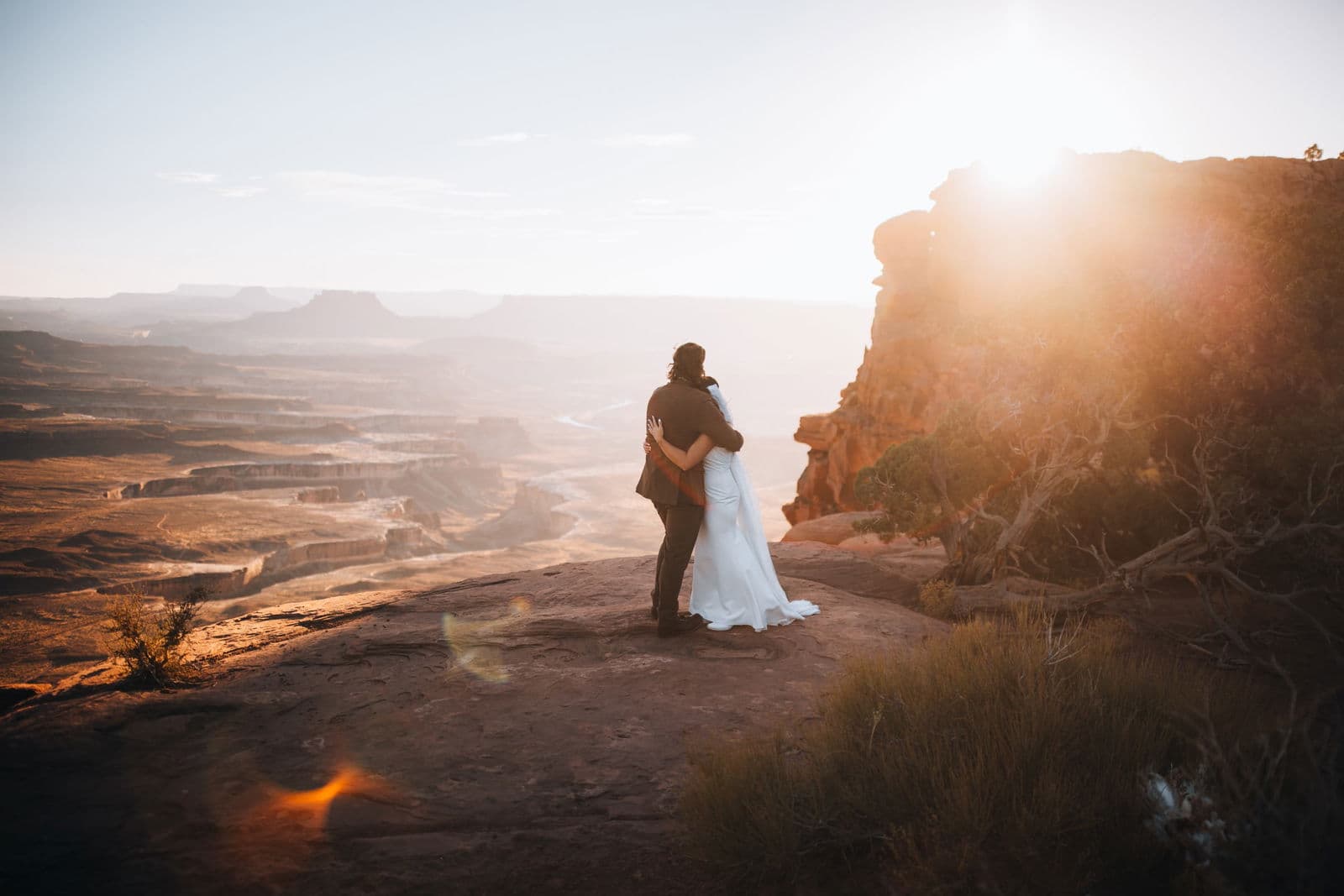 Silhouetted embrace against canyon sunset